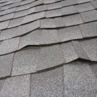 Buckled Roofing shingles